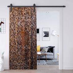 a living room with a large wooden door