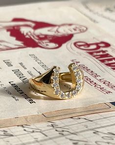 The Lucky Horseshoe Ring is here to bring you Luck! This chunky gold plated silver ring with cubic zirconia will definitely be your new favorite. About 1/2 inch in width. Gold Horseshoe Ring, Lucky Ring, Horseshoe Jewelry, Horse Ring, Horseshoe Ring, Lucky Horseshoe, Luxury Rings, Rings Engagement, Jewelry Rings Engagement