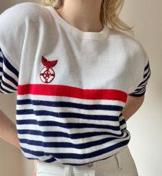 This stunning short-sleeved sweater from the 60s fits the old-money aesthetic so well! It has rounded sleeves and a gorgeous embroidered life ring.  - Perfect vintage condition  - Navy, red and a soft white  - Made in Canada  - 100% Acrylic  Size : women's M ( tagged a vintage size Large)  ~ Measurements ~  Length : 23.5 Shoulder to shoulder : 20 Bust : 40 Waist : 38 Lower Waist  Sleeve Inseam :28 (stretches to 42) * in inches  * colour may differ on different monitors ~ General information ~ * Old Money Boat, 60s Fits, Marine Aesthetic, Etiquette Vintage, Life Ring, Vintage Nautical, Old Money Aesthetic, Old Money, Women Pullover