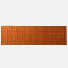 an orange rug with squares on it