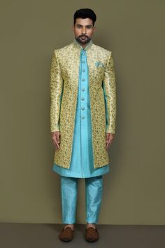 Yellow and blue full sleeves layered sherwani crafted in jacquard silk with Padma garden pattern detailing on the outer layer, plain front button detail inner layer and hand embroidered neckline. Paired with a blue Aligadhi pant. - Aza Fashions Garden Pattern, Embroidered Neckline, Satin Color, Self Design, Band Collar, Yellow And Blue, Full Sleeves, Button Detail, Pocket Square