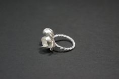 -Product description- Handmade sterling silver (925) jasmine ring. The ring shank is handmade with twisted and beaded wire. The inner surface of the jasmine petal was carefully hand textured to be shimmery. While the outer layer was smooth and shiny, to give a beautiful contrast. A freshwater pearl was then attached to give an elegant touch. Great as a gift for her, or a treat for yourself. The jasmine blossom and bud part are about 25mm in length (1 inch) and 17mm (11/16 inch) in width, weighin Elegant Adjustable Sterling Silver Flower Ring, Elegant Handmade White Gold Flower Ring, Handmade Delicate Silver Flower Ring, Handmade Delicate Flower Ring In Sterling Silver, Delicate Handmade Silver Flower Ring, Handmade White Gold Sterling Silver Flower Ring, Handmade White Gold Flower Ring In Sterling Silver, Delicate Silver Pearl Ring Gift, Handmade Elegant Silver Flower Ring