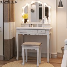 a white vanity with stool and mirror in a room