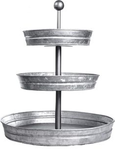 three tiered metal tray with two balls on top