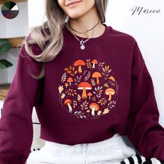 Mushrooms and Leaves Unisex Crewneck Sweatshirt | Wild Mushroom Cottagecore Jumper | Nature Forest Lover Jumper  ✔️ Super comfy unisex heavy blend crewneck sweatshirt  ✔️ 50% cotton 50% polyester ✔️ Medium-heavy fabric (8.0 oz/yd² (271.25 g/m ✔️ No side seams ✔️ Ribbed knit elastic collar to help collar retain its shape ✔️ Sewn-in label 📏 Runs true to size ✨ Care instructions: Machine wash: cold (max 30C or 90F). Turn inside out before washing to protect the print. Non-chlorine: bleach as neede Relaxed Fit Mushroom Print Top For Fall, Relaxed Fit Fall Tops With Mushroom Print, Relaxed Fit Top With Mushroom Print For Fall, Casual Plants Print Sweatshirt For Fall, Casual Long Sleeve Top With Mushroom Design, Winter Cotton Tops With Mushroom Print, Fall Casual Sweatshirt With Plant Print, Cotton Sweatshirt With Plants Print For Fall, Cottagecore Jumper