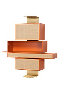 an orange shelf with two drawers on it