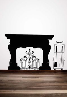 an image of a fireplace in the middle of a room with a wall decal on it