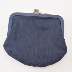 Cool vintage navy blue fabric coin purse.  Has a kiss lock clasp and is not lined. Unknown maker.  No tags. c 1950s - 1960s Condition is excellent.  There are stains, holes, rips or tears.  Inside is clean.  Ready for use. Fabric Coin Purse, Navy Blue Fabric, Vintage Purses, A Kiss, Coin Purses, Rhinestone Brooches, Diamond Solitaire Rings, Purse Pouch, Blue Fabric