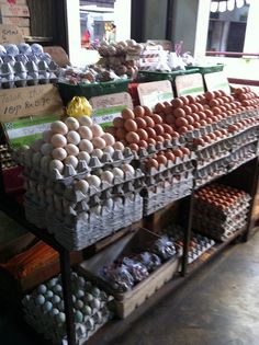 an assortment of eggs on display in a store