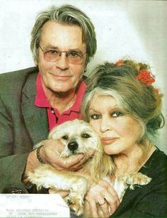 an older man and woman holding a small dog on the cover of time out magazine