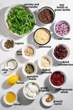 the ingredients to make this salad are shown in bowls on a white surface with their names