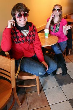 two women sitting at a table in a restaurant