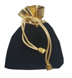 a black velvet bag with gold handles and a knot around the handle, on a white background