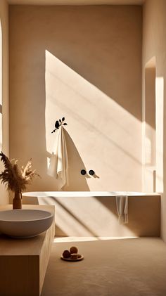 a bath room with a large window and a bowl on the floor next to it