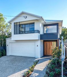 a two story house with an attached garage