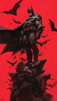 a batman standing on top of a pile of bats in front of a red sky