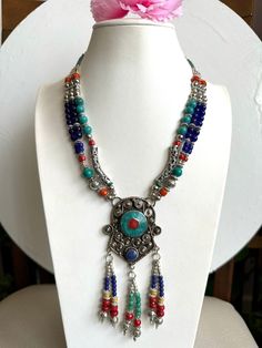 This beautiful looking three strand Tibetan boho tribal theme handmade dangle necklace is 18"inches long and weighs around 104 grams.This beautiful necklace is made from tibetan silver inlaid with turquoise,coral and lapis stone by skilled artisan from Nepal. Great piece to add with your jewelry collection from asia.Thank you. Lapis Stone, Dangle Necklace, Dangle Necklaces, Wedding Jewellery Necklace, Coral Turquoise, Handmade Boho, Beautiful Necklace, Handmade Necklace, Wedding Necklace