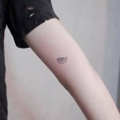 a person with a small tattoo on their arm