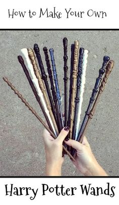 a person holding up a bunch of different types of baseball bats in their hands on the ground