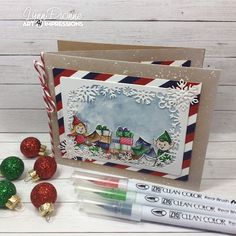 Lynn used stamps and dies from Art Impressions for this wonderful Accordion style Christmas card. There are three stamped scenes, the front and second panel shows elves getting letters for Santa and packaging gifts. And the last shows Santa mailing … Read More...