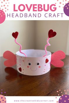 a paper cup with hearts on it and the words lovebug headband craft