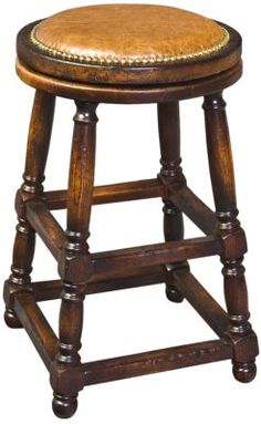 a wooden stool with a leather seat on it's backrest and foot rest