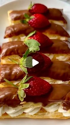 strawberries are arranged on top of chocolate covered pastry