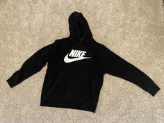 Nike Swoosh Logo Graphic Hooded Sweatshirt Hoodie Adult Medium M W/front Pocket. Please see photos before purchasing, all sales are final. My son outgrew this hoodie before he had a chance to wear it very much. It is used, preowned, and he wore it only a handful of times. It is black and has the classic Nike logo with swoosh in white. Convenient front pocket makes this hoodie a favorite. If you have any questions, please ask before purchasing. All sales are final, not a stock photo, what you see Best Hoodies For Men Nike, Nike Jumper, Black Nike Hoodie, Nike Women Sweatshirt, Nike Swoosh Logo, Nike Sweatshirts, Swoosh Logo, Nike Swoosh, Branded Sweatshirts