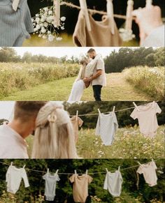 a couple standing next to each other in front of clothes hanging on a line with flowers