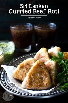 some food is sitting on a plate and ready to be eaten with sauces in the background