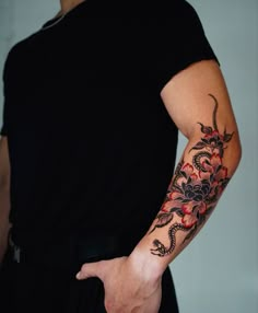 a man with a dragon tattoo on his arm