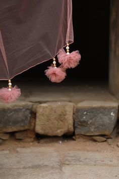 Featuring Onion Pink silk peplum with mirror, zardozi embroidered, paired with georgette inserted sharara and net choker dupatta with our signature hangings. Fabric - Silk, Georgette and net Components - 3 Colour - Onion Pink Embroidery details - Hand Embroidery Delivery time - 2-3 weeks Washing Instructions - Dry-clean Organza Sharara With Sheer Dupatta, Celebration Set With Sheer Dupatta In Georgette, Celebratory Set With Sheer Dupatta In Georgette, Elegant Anarkali Set With Mirror Work, Fusion Style Sharara For Wedding And Festivals, Festive Celebration Fusion Sets, Traditional Net Anarkali Set With Cutdana, Party Sharara With Gota Work In Organza, Organza Anarkali Set With Dori Work For Party