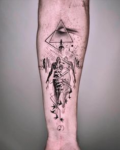 a man's leg with an abstract tattoo on it