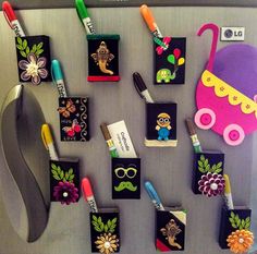 the magnets on the refrigerator are decorated with different things to put in it's holders