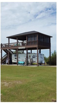 an rv park with a large deck and stairs leading up to it