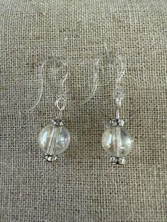 Classy small glass bead earrings. Approximately 1.5 inches long including plastic earring. Everyday Glass Drop Earrings, Everyday Glass Dangle Jewelry, Clear Drop Earrings With Matching Set, Elegant Hypoallergenic Glass Jewelry, Everyday Clear Glass Jewelry, Glass Jewelry With Ear Wire, Hypoallergenic Czech Glass Jewelry, Elegant Hypoallergenic Glass Earrings, Hypoallergenic Round Glass Jewelry