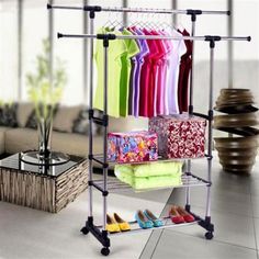 an ironing rack with clothes and shoes on it