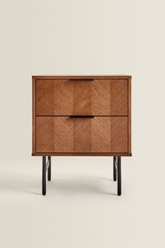 the sideboard is made out of wood and has two drawers, one with an open drawer