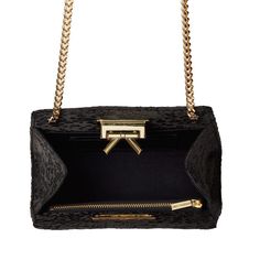 Handmade in New York, the Grace bag is crafted of black satin with a black and silver embroidery. Features a signature bow detail and gold hardware closure. High-end Black Formal Bags, Designer Evening Bags With Detachable Strap, High-end Black Top Handle Evening Bag, Gold Leather Bag For Events, High-end Rectangular Clutch For Formal Occasions, High-end Rectangular Clutch For Formal Events, Black Luxury Shoulder Bag For Events, Luxury Black Shoulder Bag For Events, High-end Formal Rectangular Clutch