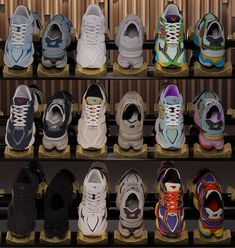 there are many pairs of shoes on the shelves in this display case, all different colors and sizes