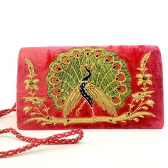 "Stunning glittery peacock embroidery on burgundy red velvet evening clutch bag using silk, metallic gold tone threads and genuine semi precious stones. Dazzling gold work on tail and glittery wings! Such lavish details! You will certainly stand out and be noticed wearing this purse. Perfect gift for a peacock lover! Expertly hand embroidered by zardozi artisans. Our aim is the preservation of the zardozi art form. Zardozi means \"gold thread\" or \"writing with gold\". It is an elaborate multid Gift Shoulder Bag With Gold Embroidery, Velvet Bags For Festivals And Gifts, Rectangular Evening Bags For Diwali, Hand Embellished Rectangular Evening Bag For Festivals, Festival Hand Embellished Rectangular Evening Bag, Festival Rectangular Hand Embellished Evening Bag, Velvet Evening Bag As A Gift, Traditional Evening Bag With Gold Embroidery, Velvet Bag For Festive Occasions