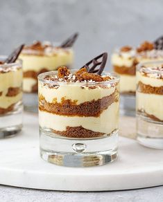 small desserts are arranged on a white tray