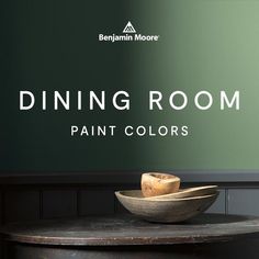 a bowl sitting on top of a wooden table next to a wall with the words dining room paint colors