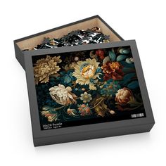 a puzzle box with an image of flowers on it's side and the lid open