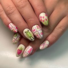 These nails feature a delightful summer design with a white base adorned with colorful strawberries, flowers, and a cute frog. The vibrant and playful elements capture the essence of a sunny garden.  🌸Click on the image to shop our trending Korean Gel Polish this season.  🌸Credit: nails_with_that_one_girl on Instagram 🌸summer nails, gel polish, Korean nail art, strawberry nails, floral nails, cute nail design, frog nails, colorful nails, garden nails, white nails, vibrant nails, playful nails, trendy nails, seasonal nails, nail trends, summer manicure, Instagram nails, nail inspiration, nail designs, hand-painted nails Nails Cute Animals, Nail Inspo Cottagecore, Cute Frog Nail Designs, National Park Nails, Badtz Maru Nails, Capybara Nails, Summer Nails Gel Polish, Cottage Nails, Nail Art Strawberry