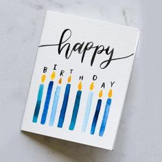 a birthday card with candles on it and the words happy birthday written in black ink