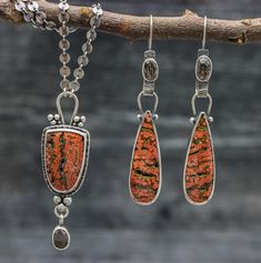 This pendant features orbicular jasper and rose agni manitite. The orbicular jasper is so pretty, it has coral pink orbs on a brown base with druzy pockets for some added sparkle. I have paired it with the manitite because it has the brown color that is a good match for the jasper. Manitite is also called Rose of the Divine Fire because it was created from a meteorite crash thousands of years ago. Flip the pendant over and I have textured the metal with a pattern that mimics the pattern in the s Earthy Jasper Jewelry With Natural Stones, Earthy Jasper Gemstone Jewelry, Earthy Ocean Jasper Jewelry With Natural Stones, Unique Jasper Jewelry With Natural Stones, Unique Ocean Jasper Jewelry With Natural Stones, Earthy Ocean Jasper Jewelry Gift, Brown Jasper Gemstone Jewelry, Artisan Jasper Jewelry With Stones, Artisan Jasper Stone Jewelry