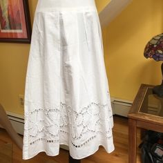 100 % Cotton, Fully Lined Skirt With Gorgeous Embroidery Around The Hem And Sewn In Pleats Elegant Summer Skirt With Cutwork Hem, Elegant White Skirt With Cutwork Hem, White Embroidered Full Skirt, Fitted White Skirt With Embroidered Hem, Elegant Bottoms With Embroidered Hem For Spring, Elegant White Skirt With Embroidered Hem, Elegant Cotton Skirt With Embroidery, Elegant Cotton Embroidered Skirt, Elegant Embroidered Cotton Skirt