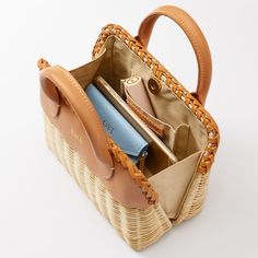 Inspired by warm nights, seaside breezes and coastal destinations the artfully woven Seaside Wicker Handbag has an exquisite braided leather accent that displays its skillful handcraftsmanship. A compact handbag, it has a striped cotton lining, handy interior pocket and magnetic closure. A foil debossed monogram on the leather top adds a personal touch.   About the artisan: This item is handmade by artisans in the Philippines. A woman-owned and operated organization, they are a member of the Nes Cane Baskets, Basket Bags, Kids Pottery, Straw Handbags, Mark And Graham, Summer Lovin, Beauty Clothes, Basket Bag, Pottery Barn Teen