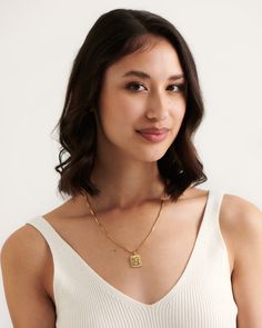 Timeless elegance combined with modern playfulness to create our gold Ancona necklace. Minimal yet detailed this necklace is the perfect layering piece you need in your summer wardrobe. Wear with the colourful Pompei Necklace or keep it classic with our Monti choker. 
Details

Handcrafted in a thick layer of 18k gold on sterling silverAdjustable chain length: 50 cm + 5 cm extenderPendant size: 1,8 cm x 1,6 cmChain width: 1,6 mmLuxurious cotton pouch & jewellery box with every order Bruna The Label, Fair Trade Jewelry, Tahitian Black Pearls, Cotton Pouch, Recycled Jewelry, Sustainable Jewelry, Recycled Silver, Freshwater Cultured Pearls, Unique Gemstones